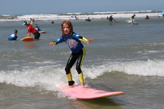 Learn to Surf at Middleton Beach - Getting up on the board: sand practice first, then gentle waves